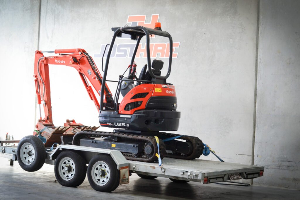 Kubota U25 2.5t excavator on trailer, available for hire at JustHire